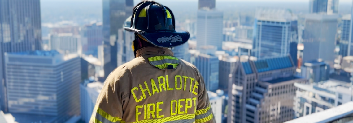 Firefighter overlooking city
